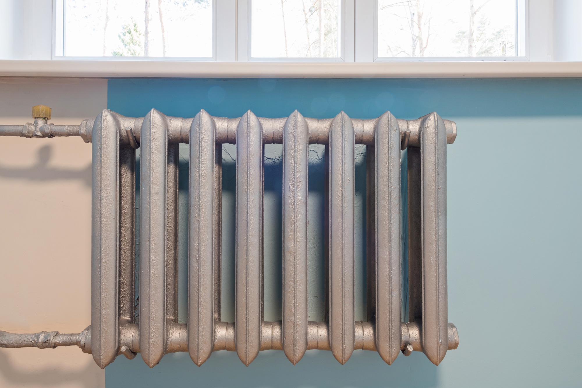 Cast iron radiator of water on the wall heating in a home